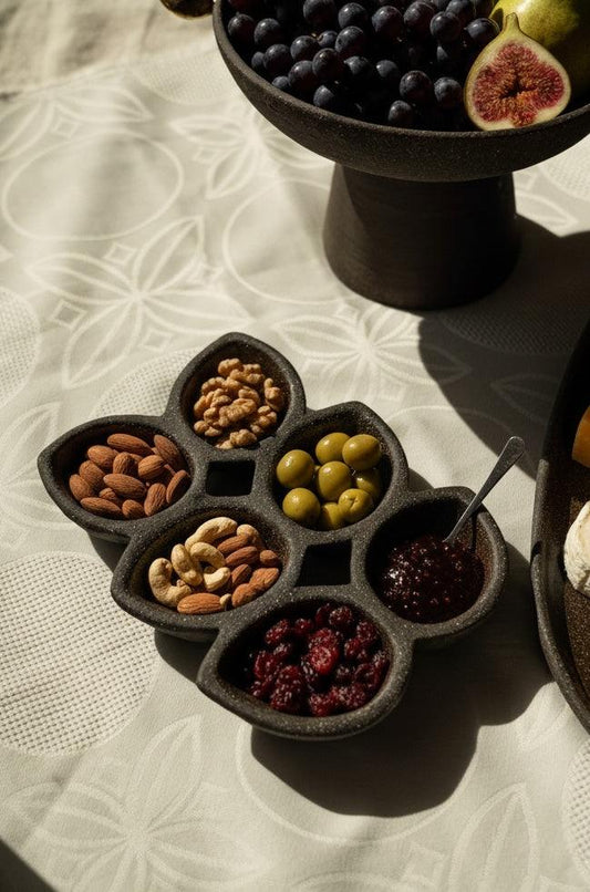 Stoneware Serving Dish in deep earthy brown stoneware, with a matte textured finish and six petal-shaped compartments.