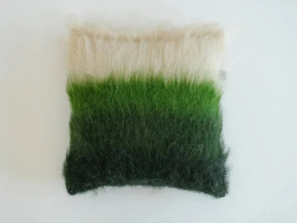 Emerald, green, and cream handwoven wool pillow with brushed texture and natural warmth