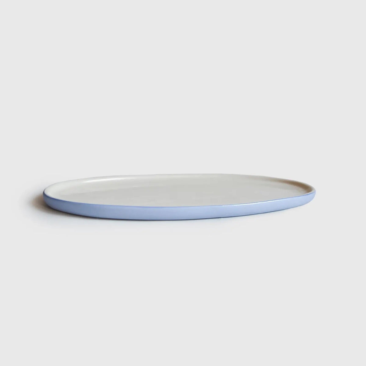 Handmade porcelain Serving Platter, oval with a pale blue exterior and smooth white glazed interior.