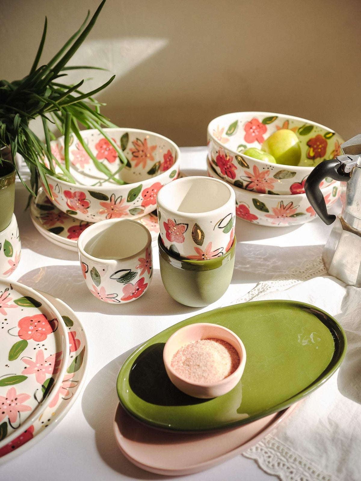 Hand-Painted Floral Coffee Cup with a glossy ivory porcelain body, pink and red flowers, green leaves, and gold accents