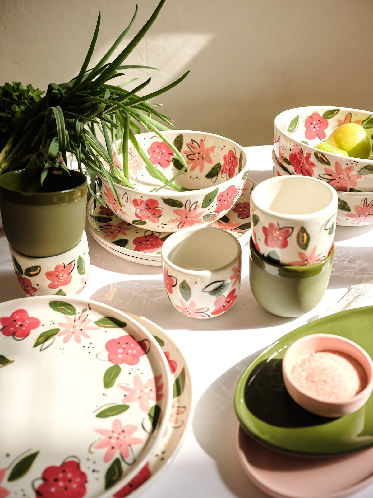 Hand-Painted Floral Coffee Cup in glossy cream porcelain, decorated with red and pink flowers, green leaves, and gold accents.