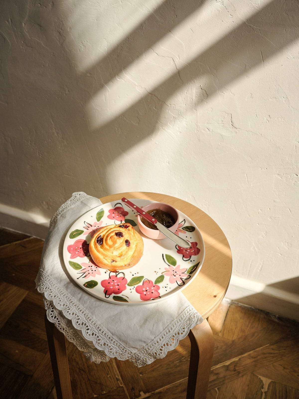 Hand-Painted Floral Dinner Plates in off-white porcelain, decorated with red and pink flowers, green leaves, and gold accents.