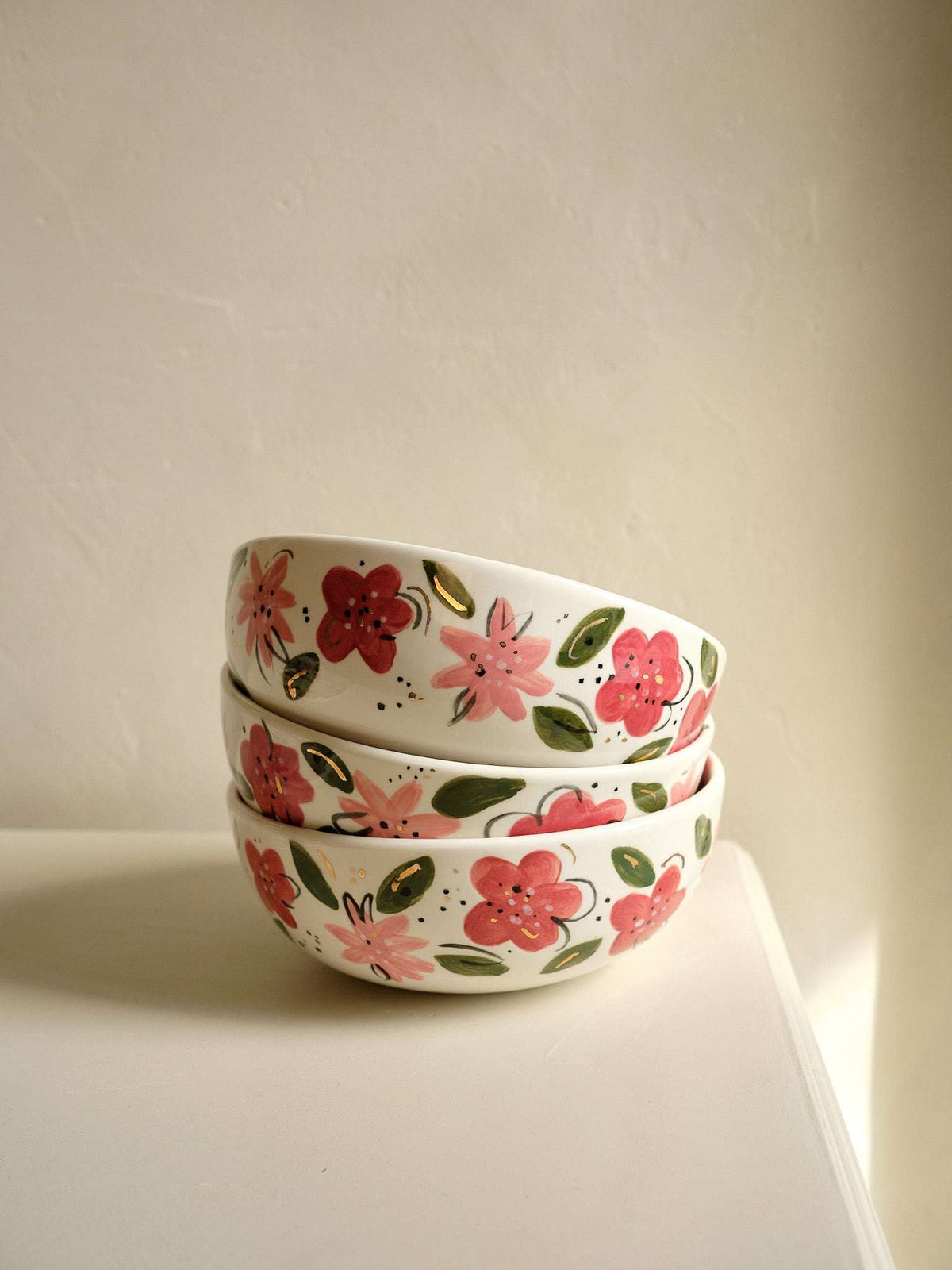 Hand-Painted Floral Salad Bowl, off-white porcelain with hand-painted pink and red flowers, green leaves, and gold accents.