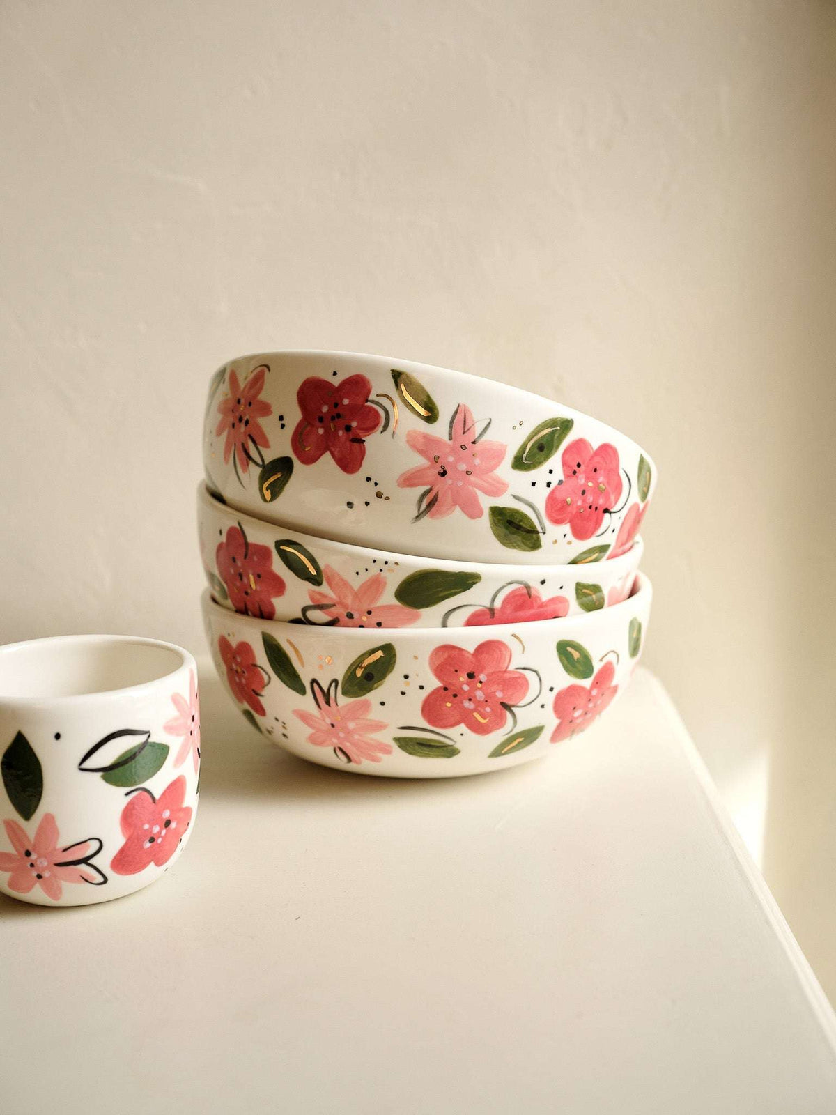 Hand-Painted Floral Salad Bowl in off-white porcelain, decorated with hand-painted pink and red flowers, green leaves, and gold accents.