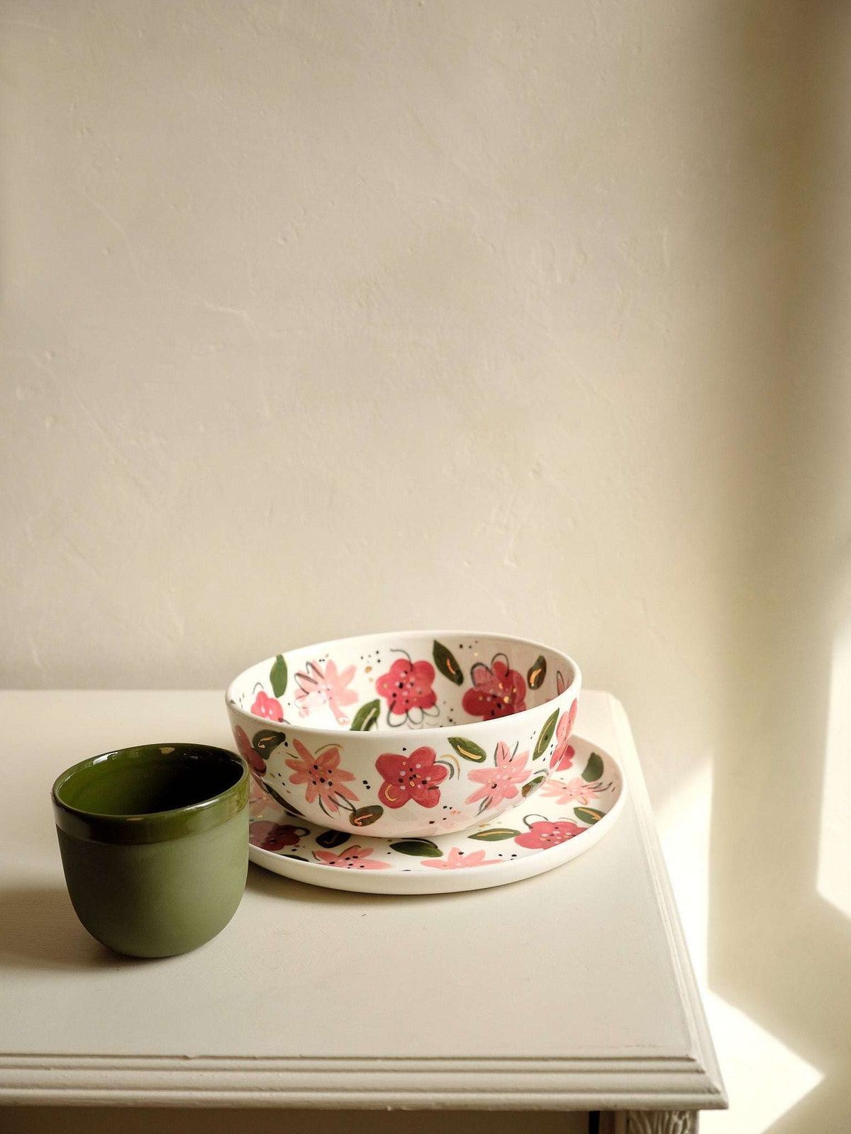 Hand-Painted Floral Salad Bowl in off-white porcelain, decorated with pink and red flowers, green leaves, and a matching plate.